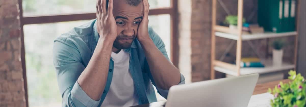 frustrated young african entrepreneur with sad grimace in front of picture id929128392